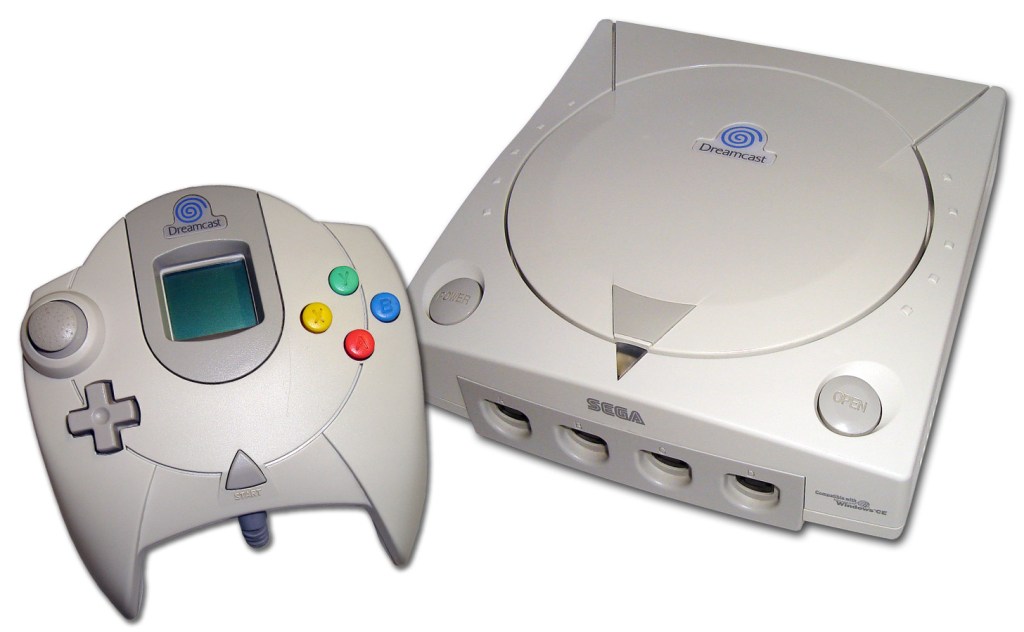 The SEGA Dreamcast and control pad with a VMU.