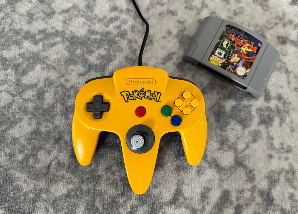 Banjo Kazooie cartridge and Nintendo 64 controller complete with loose joystick